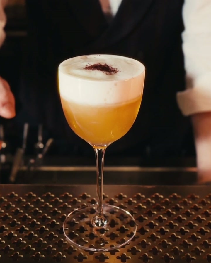 The finished With Everything cocktail with Ayran foam and a pinch of sumac